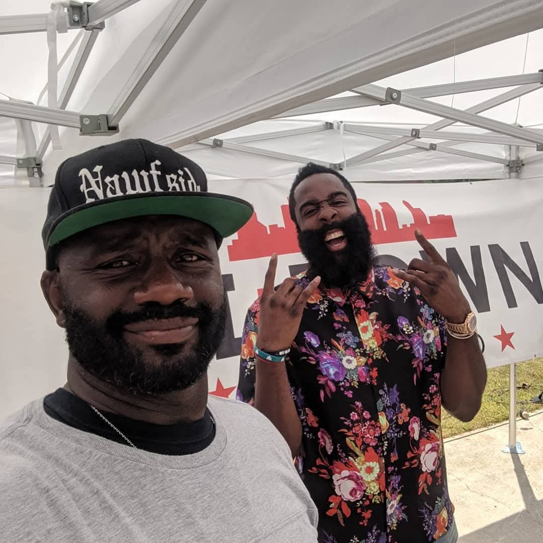 Jerry Davis with Houston Rockets star James Harden at a District B community event